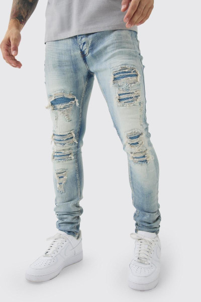Супервузькі стрейч-блідо-блакитні байкерські джинси з рваними і відновленими накладками
