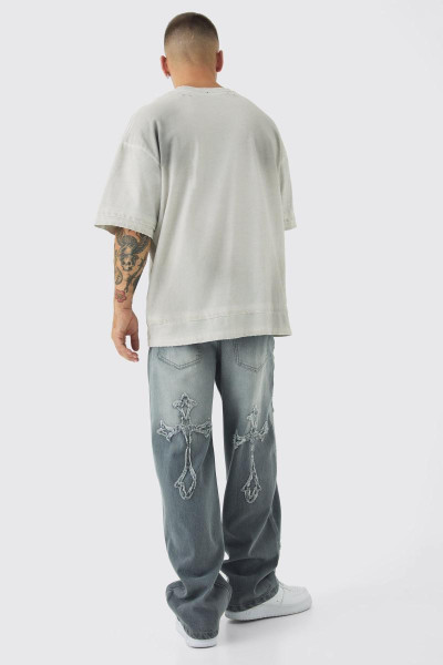 Мішкуваті світло-сірі джинси з жорсткою хрестовою аплікацією