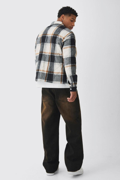 Розслаблені жорсткі коричневі витерті джинси