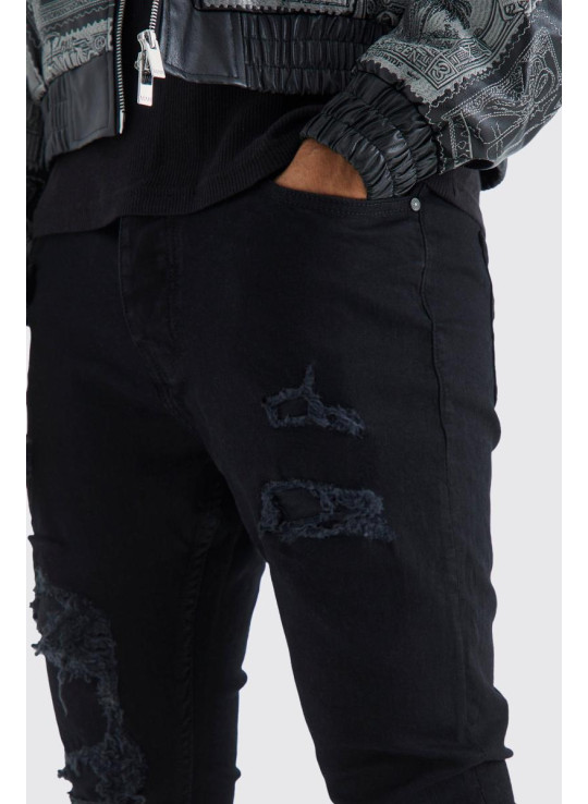 Вузькі складені потерті рвані джинси