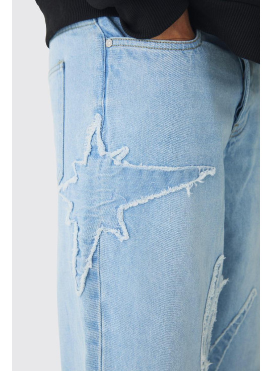 Мішкуваті жорсткі джинси з необробленими краями з аплікацією