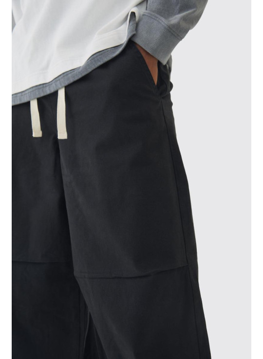 Високі мішкуваті штани з еластичною талією і контрастним шнурком