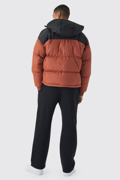 Вигнутий стьобаний пуховик із капюшоном із кольоровими блоками кольору Rust