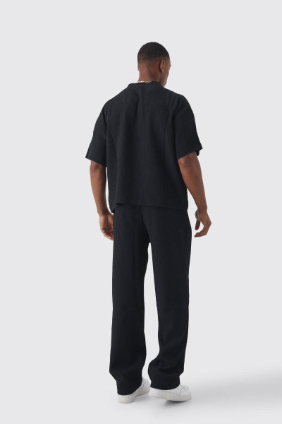 Штани в складку вільного крою з еластичною талією