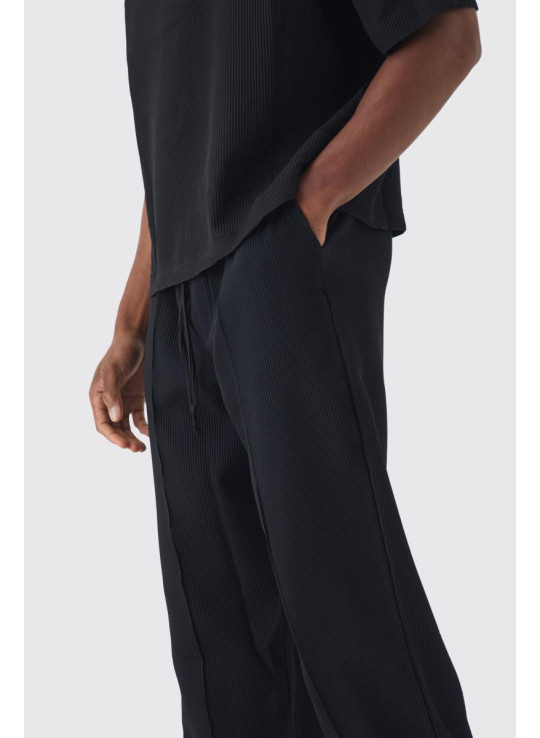 Штани в складку вільного крою з еластичною талією