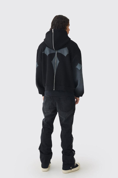 Тонкі джинси з кльошем і хрестовою аплікацією