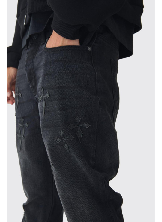 Тонкі джинси з кльошем і хрестовою аплікацією