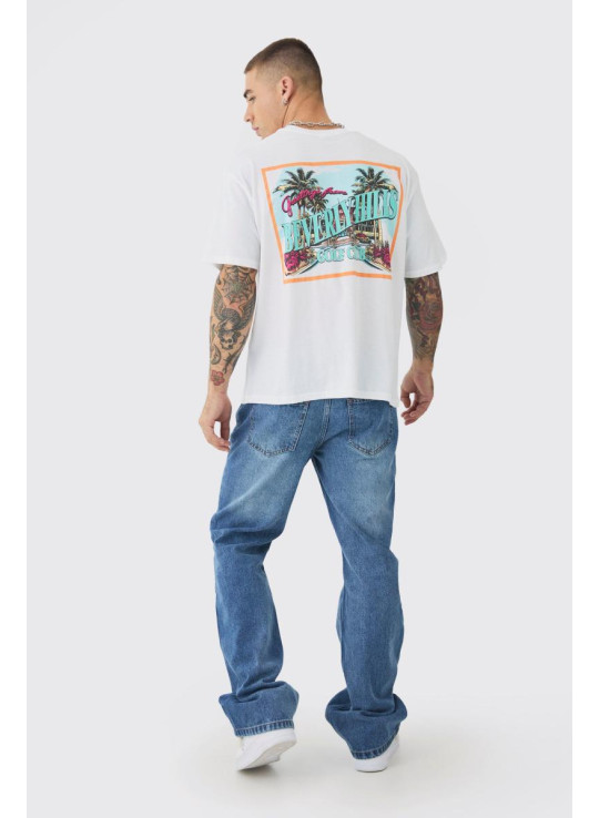 Розслаблені джинси з кльошем середнього синього кольору