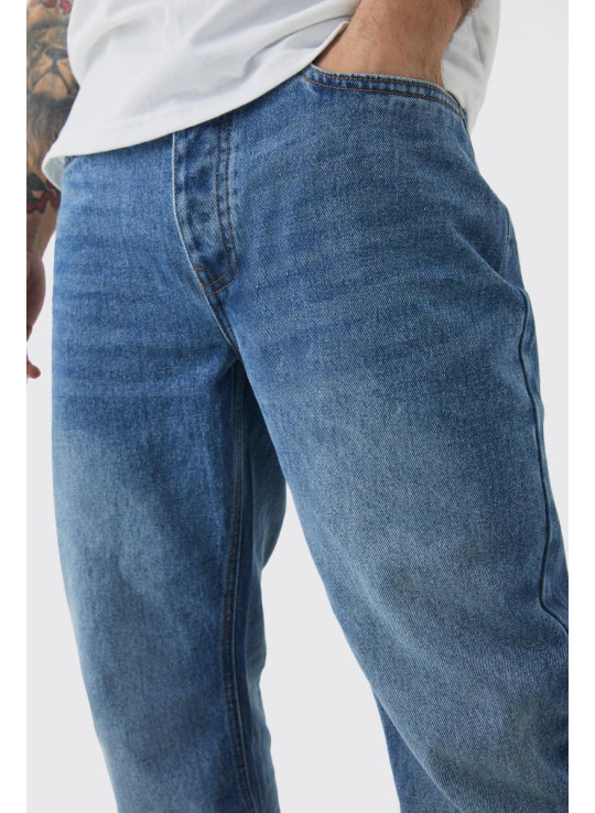 Розслаблені джинси з кльошем середнього синього кольору