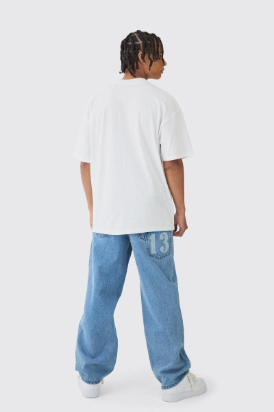 Мішкуваті жорсткі джинси Homme з лазерним принтом