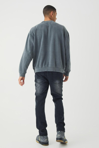 Тонкі рвані джинси з пофарбованими плямами